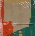 Abstract background. Fragment of brown cardboard transport packaging plastered with colored duct tape and polyethylene. Royalty Free Stock Photo