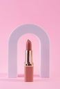 Abstract background with geometric forms for product presentation lipstick, lipgloss on pink background. arch to show