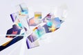 Abstract background with glass geometric figures prisms with light diffraction of spectrum colors and complex reflection