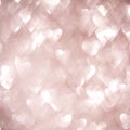 Abstract background of heart shapes with soft glowing light and bokeh effect