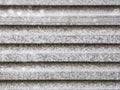 An abstract background image of a horizontal section of unpainted galvanised steel
