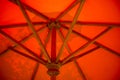 Abstract background of the inside of an orange umbrella with wooden supports Royalty Free Stock Photo