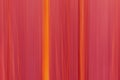 Abstract motion blur background in red and orange with vertical lines.