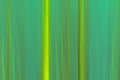 Abstract motion blur background in tints of green with vertical lines