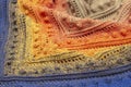 abstract background. Knitted multi-colored scarf on the neck. knitted textural background. color Royalty Free Stock Photo