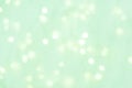 Abstract background. light celadon green blurry lights. bokeh. texture. concept for christmas, new year, holiday Royalty Free Stock Photo