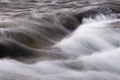 Abstract background from long exposure of water stream in a mountain river Royalty Free Stock Photo