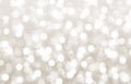 Silver blurred bokeh background, gray, white circles, beige, defocusing, holiday, glitter, glow, light effect, magic