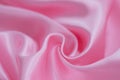 Abstract background of luxury pink wrinkled silk cloth, liquid waves, wavy folds for background texture Royalty Free Stock Photo