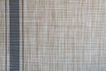 Abstract background made of brown woven matting with a gray stripe along the edge of the edge Royalty Free Stock Photo