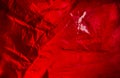 Abstract background made of red plastic bag and back lit flash light. Grunge texture. Vibrant colors Royalty Free Stock Photo