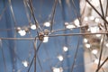 abstract background is a metal structure made of thin rods with light bulbs in a geometric sequence. strange art objects Royalty Free Stock Photo