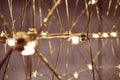 abstract background is a metal structure made of thin rods with light bulbs in a geometric sequence. strange art objects Royalty Free Stock Photo