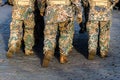 Abstract background on military theme. Soldier rank, legs, close-up. Rear view. - image