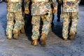 Abstract background on military theme. Soldier rank, legs, close-up. Rear view. - image