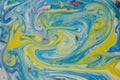 Abstract background mixed with yellow and blue swirls of ink