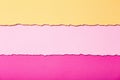 Abstract background of multi-colored stripes of torn cardboard lying horizontally, top view Royalty Free Stock Photo