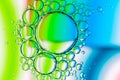 Abstract Background of Oil Bubbles on Water Surface blue green white palette Royalty Free Stock Photo