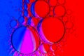 Abstract Background of Oil Bubbles on Water Surface purple red blue magenta colorful palette Royalty Free Stock Photo