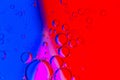 Abstract Background of Oil Bubbles on Water Surface purple red blue magenta colorful palette Royalty Free Stock Photo