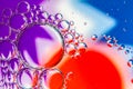 Abstract Background of Oil Bubbles on Water Surface purple red blue white colorful palette Royalty Free Stock Photo