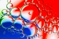 Abstract Background of Oil Bubbles on Water Surface red white blue palette Royalty Free Stock Photo