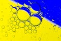 Abstract Background of Oil Bubbles on Water Surface yellow blue colorful palette Royalty Free Stock Photo