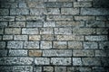 Abstract background of old cobblestone pavement. Grey stone brick paving texture. Close up of ancient road. Walking in an old city Royalty Free Stock Photo
