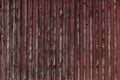 Abstract Background of old painted wood. Wooden fence with traces of old cracked faded paint on the wood surface Royalty Free Stock Photo