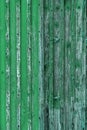 Abstract Background of old painted wood. Wooden fence with traces of old cracked faded paint on the wood surface Royalty Free Stock Photo