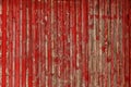 Abstract Background of old painted wood. Wooden fence with traces of old cracked faded paint on the wood surface Royalty Free Stock Photo