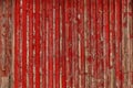 Abstract Background of old painted wood. Wooden fence with traces of old cracked faded paint on the wood surface Royalty Free Stock Photo