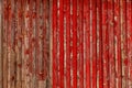 Abstract Background of old painted wood. Wooden fence with traces of old cracked faded paint on the wood surface Royalty Free Stock Photo
