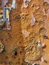 An abstract background of an old rusty weathered steel surface with fragments of letters