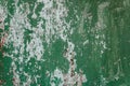 Old shabby rusty metal wall. Shabby, cracked green paint. Grunge background Royalty Free Stock Photo