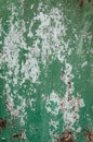 Old shabby rusty metal wall. Shabby, cracked green paint. Grunge background Royalty Free Stock Photo