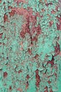 Old shabby rusty metal wall. Shabby, cracked green paint. Grunge background Royalty Free Stock Photo