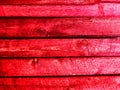 Abstract background with old wooden boards painted with red paint with texture and knots. Pattern, place for text and Royalty Free Stock Photo