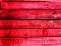 Abstract background with old wooden boards painted with red paint with texture and knots. Pattern, place for text and Royalty Free Stock Photo