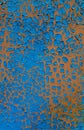 Patches of peeling blue paint on the rusty metal surface. Background, structure. Royalty Free Stock Photo