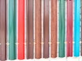 Abstract background and pattern of colored metal iron picket fence slats. Frame, place for text and copy space Royalty Free Stock Photo