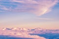 Abstract background with pink, purple and blue colors clouds. Sunset sky above the clouds. Royalty Free Stock Photo