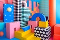 abstract background of playful convergence of 2D pop-art graphics and 3D geometric shapes creating a vibrant multiverse