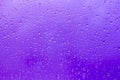 Abstract background, raindrops on the glass against the blue stormy sky Royalty Free Stock Photo