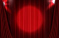 background of red curtain with round glowing spotlight ray backdrop Royalty Free Stock Photo