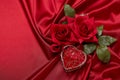 Abstract background from red silk, roses and heart. Fabric texture with draped. Copy space. Element design. Valentine`s day Royalty Free Stock Photo