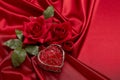 Abstract background from red silk, roses and heart. Fabric texture with draped. Copy space. Element design. Valentine`s day Royalty Free Stock Photo