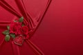 Abstract background from red silk, roses and heart. Fabric texture with draped. Copy space. Element design. Valentine`s day Royalty Free Stock Photo