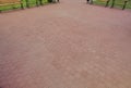 The inner yard is paved with decorative stone. Stone pavement, paved rectangular red blocks. A stone pavement.