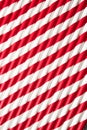 Abstract background of red and white colored paper striped cocktail straws. Royalty Free Stock Photo